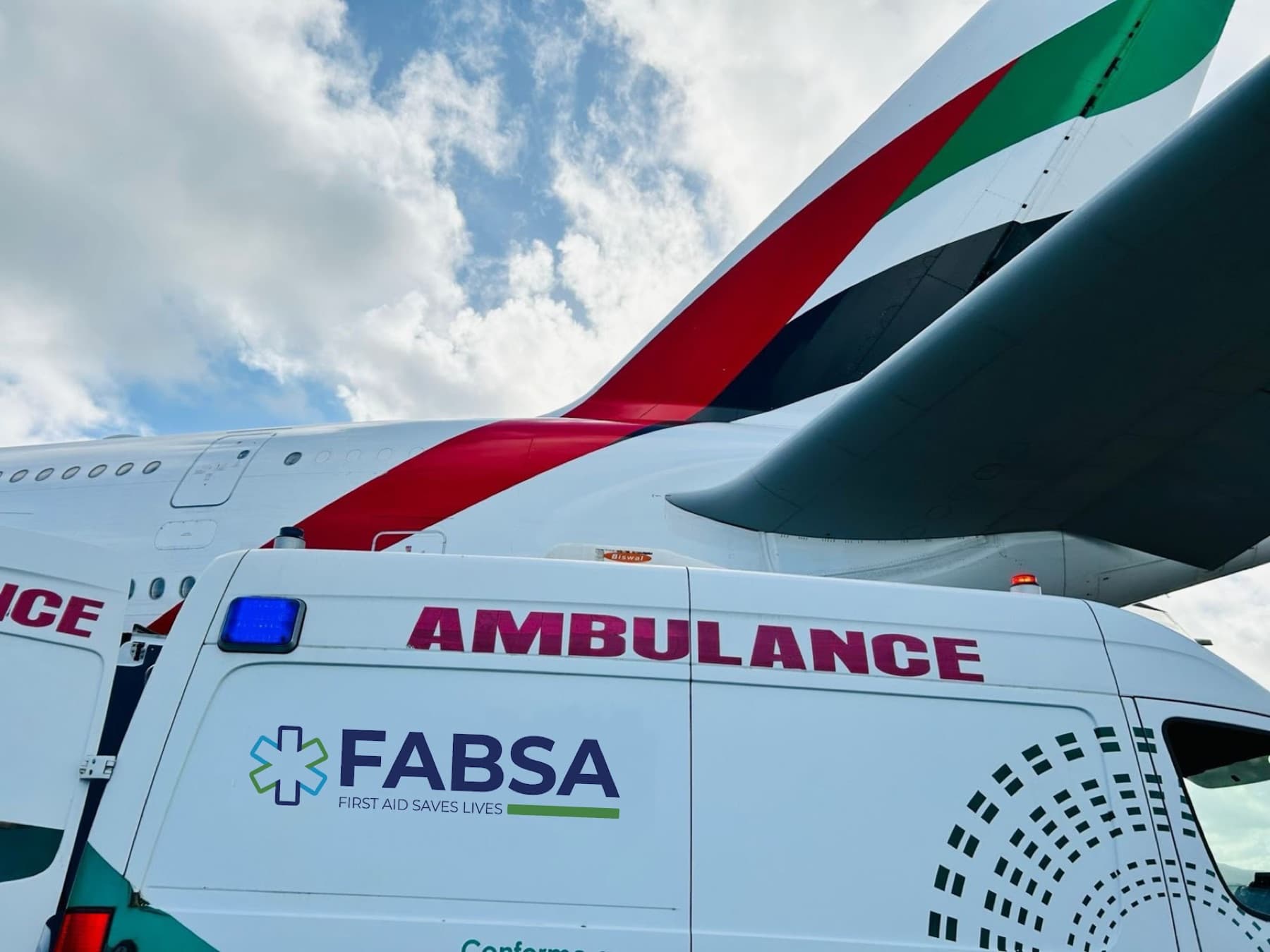 FABSA ambulance on duty at the airport, in front of an Airbus A380